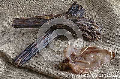 Various Dried Dog Treats on Burlap Stock Photo