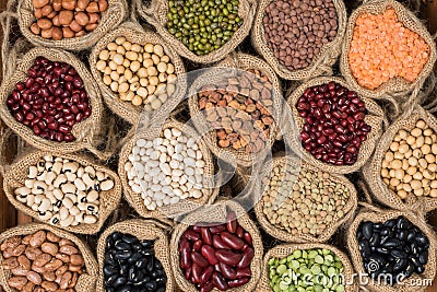 Various dry legumes in a sack cloth, Different dry legumes Stock Photo