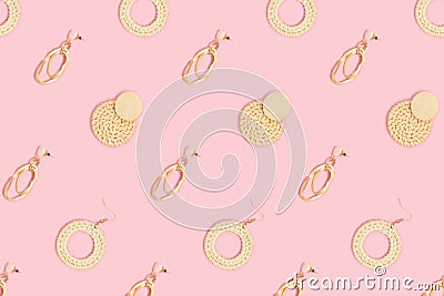 Various earrings pattern on a pink pastel background. Stock Photo