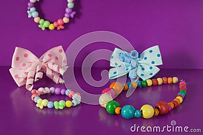 Various elastic bands, hair clips, beads, bows for girls. Stock Photo