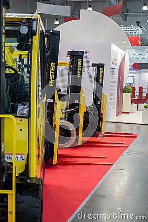 Various forklift trucks and warehouse vehicles at the International exhibition of transport and logistics services Editorial Stock Photo