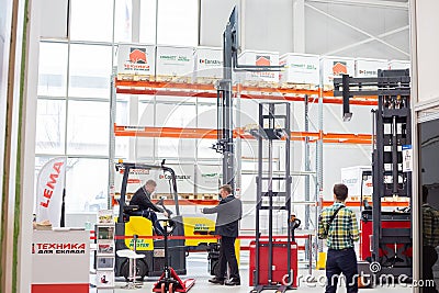 Various forklift trucks and warehouse vehicles at the International exhibition of transport and logistics services Editorial Stock Photo