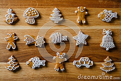 Various funny gingerbread shapes on a brown wooden table Stock Photo