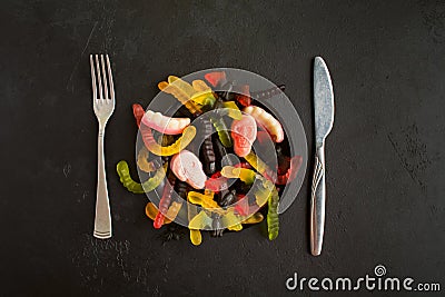 Various halloween candies over wooden table with copy space; selective focus Stock Photo