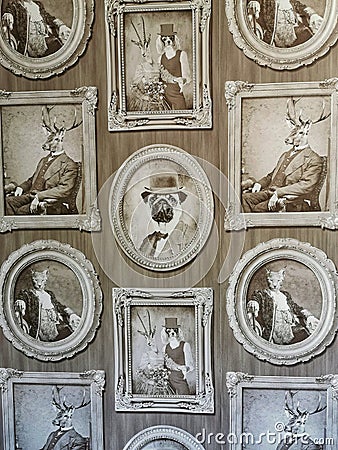 various human-animal hybrids chimeras painted in black and white and framed on a wall as an art display Editorial Stock Photo