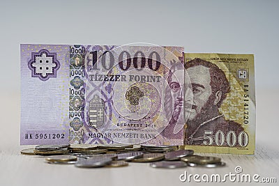 Various Hungarian Forint banknotes on coins. Stock Photo