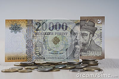 Various Hungarian Forint banknotes on coins. Stock Photo