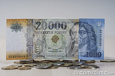 Various Hungarian Forint banknotes on coins. Stock Photo