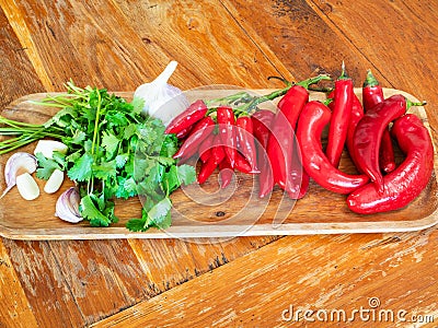 Various ingredient for Ajika on wooden board Stock Photo