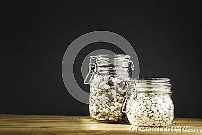 Various of kidney beans. Red, white and black kidney beans in glass storage containers. Healthy cooking, clean eating, zero waste Stock Photo