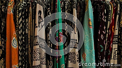 Various kind of woman's batik shirt in a store Stock Photo