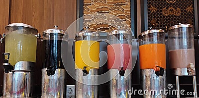 various kinds of juices in the dispenser Stock Photo