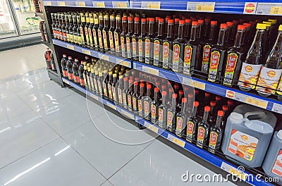 Various labels fish sauce in bottles displayed on shelves in a supermarket, Vietnamese special ingredient for cooking Editorial Stock Photo
