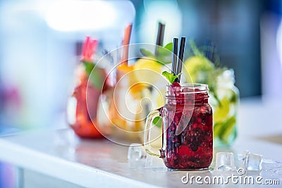 Various lemonades in mason jars with orange lime lemon otange st Stock Photo