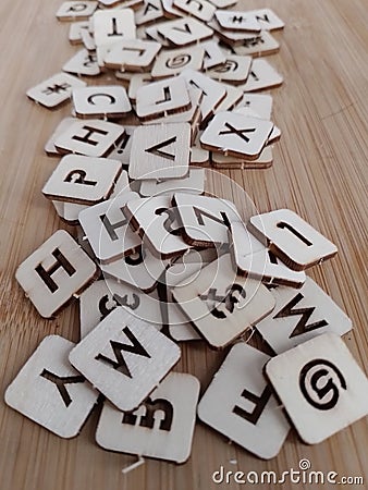 Various letters of the alphabet on a wood background Stock Photo