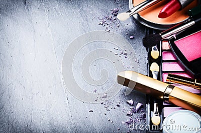 Various makeup products on dark background Stock Photo