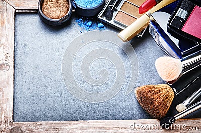 Various makeup products on dark background Stock Photo