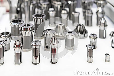 Various many type and size spring steel collet chuck for cnc machining center or automatic milling machine on table Stock Photo