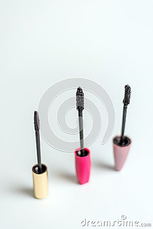 Various mascara brushes on a blue pastel background. The concept of choosing makeup products Stock Photo