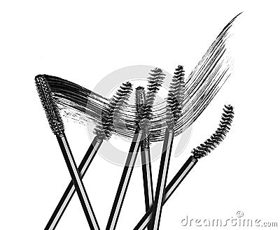 Various mascara brushes with mascara stroke on white background Stock Photo