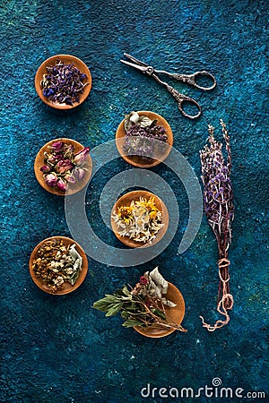 Various medical herbs and flowers in bowls Stock Photo