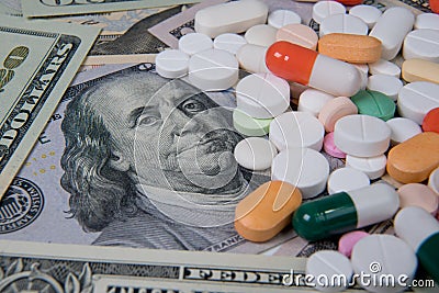 Various medicines on the US dollar. The rising cost of health care Stock Photo