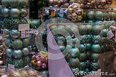 Various multicolored Christmas toys and decorations for sale in the store Stock Photo