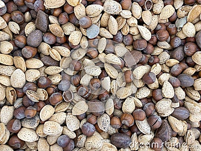 Various nuts arranged in a pile stack organic display backdrop background scene Stock Photo