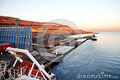 Various panoramic views of the piers, terminal and coastline of the Port of Vostocnyy, Russia. Stock Photo