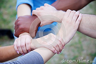 Various persons holding hands Stock Photo