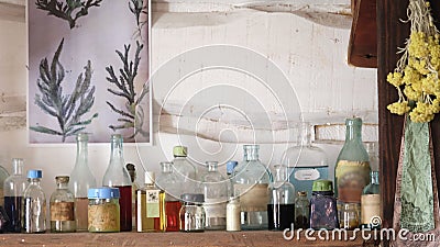 Various pharmacy bottles with homeopathic medicines on the shelf Stock Photo