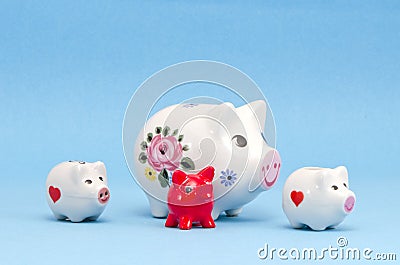 Various piggy-banks on azure background Stock Photo