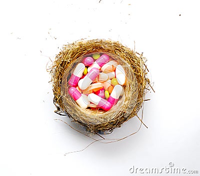 Various pilla and capsules in a bord nest, medicine concept Stock Photo