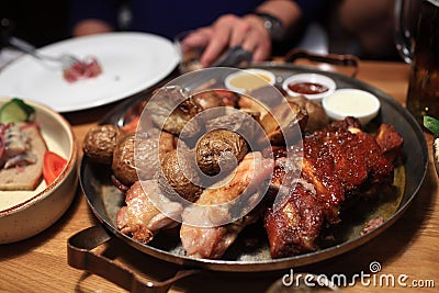 Various roasted meat with potatoes Stock Photo