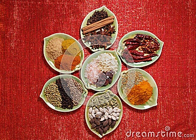 Various Spices in seven plates on glitter Stock Photo