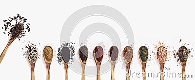 Various spices spoons on white table. Top view with copy space. Stock Photo