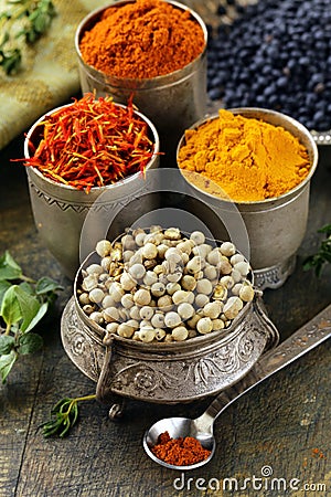 Various spices (turmeric, paprika, saffron, coriander) Stock Photo