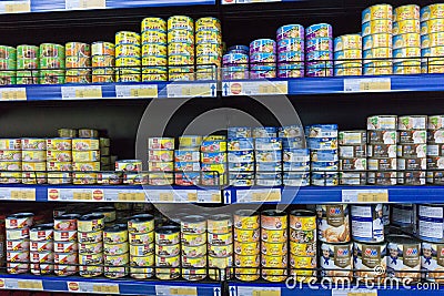 Various tinned foods and vegetables preserved in jars display on shelves in a supermarket, Editorial Stock Photo