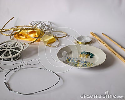 Various tools and accessories for making a pearl crown, handmade, spending free time at home, cutlery Stock Photo