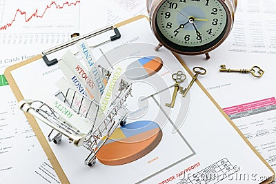 Various type of financial and investment products in a shopping cart. Stock Photo