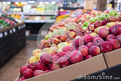 Various type of fresh fruits arrange neatly grocery store. Fresh healthy fruits on shelves in supermarket Stock Photo