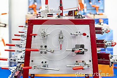 Various type metal toggle clamp or quick lock e.g. pull push latch vertical horizontal handle clamp etc. for manufacturing process Stock Photo