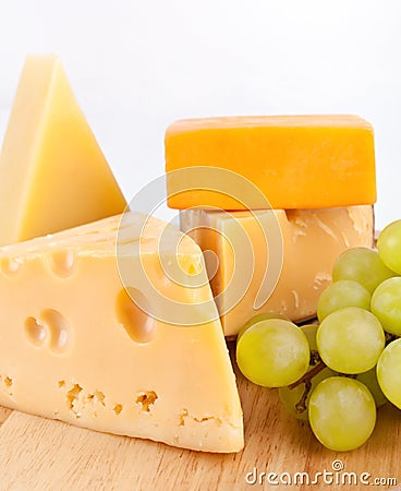 Various types of cheese with grapes Stock Photo