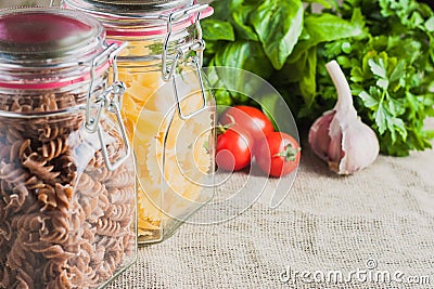 Various types of pasta, fusilli and farfalle Stock Photo