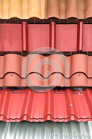 Various types of roof coverings in the window of a construction store. Stock Photo