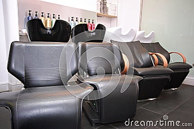 Row of hairdressers sink chairs Stock Photo