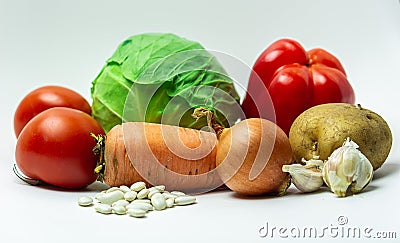 various vegetables laid out on a white background. Stock Photo