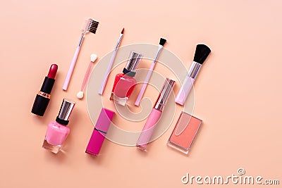 Various women makeup cosmetics on a pastel pink background. Blusher, lipstick, nail polish and brushes. Top view, flat lay, copy Stock Photo