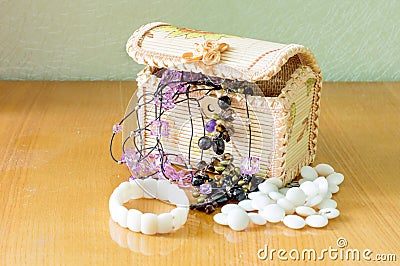 Various womens beautiful jewelry in a wicker box Stock Photo