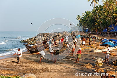 Fishing net with many fishermen on backside. Odayam beach, Varkala, India Editorial Stock Photo